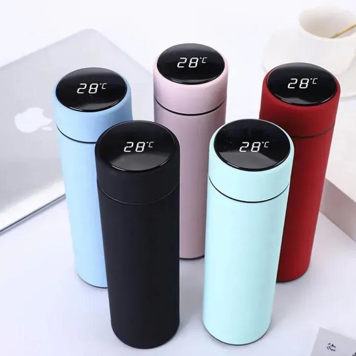 Smart insulated bottle with LED display, keeps drinks hot or cold for 24 hours, ideal for travel.
